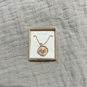 NWT Fettero necklace rotating butterfly and daisy pendent